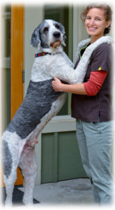 AAHA vet Kate Stevens dancing with her dog